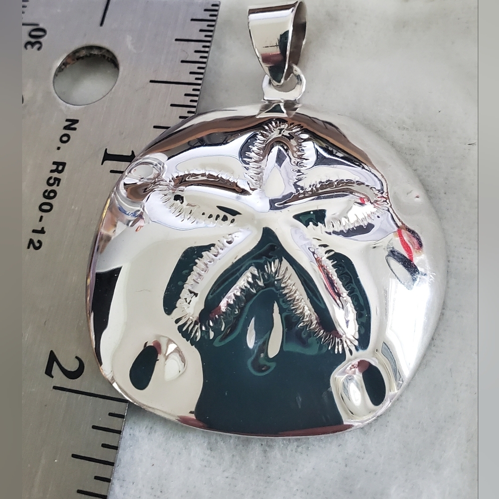 Sterling silver sand dollar pendant